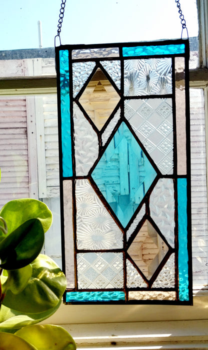 Patchwork with bevelled diamonds.