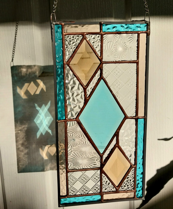 Patchwork with bevelled diamonds.