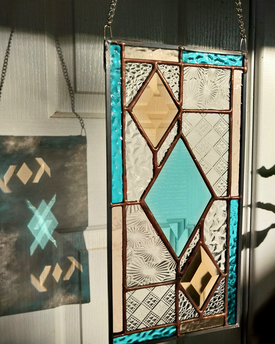 Patchwork with bevelled diamonds.