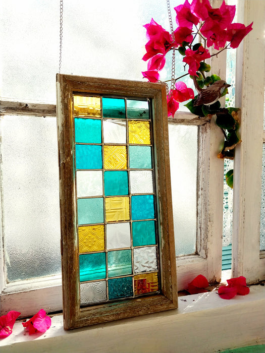 Timber framed patchwork in teal and yellow.