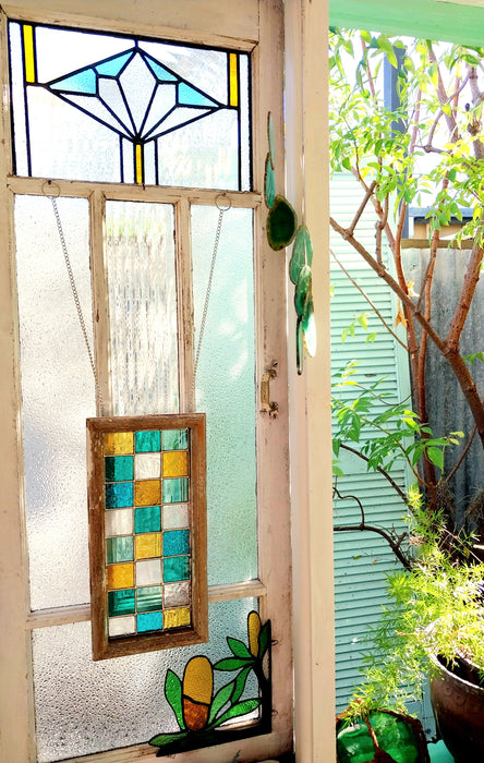 Timber framed patchwork in teal and yellow.