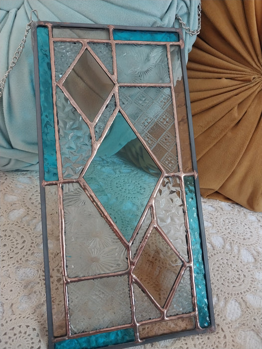 Patchwork with bevelled diamonds.
