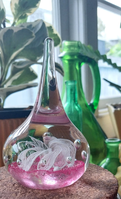 Vintage art glass paperweight in artistic teardrop design.