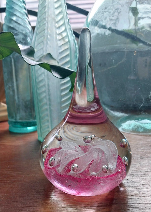 Vintage art glass paperweight in artistic teardrop design.