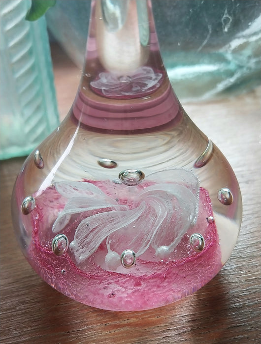 Vintage art glass paperweight in artistic teardrop design.
