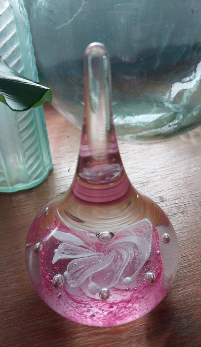 Vintage art glass paperweight in artistic teardrop design.