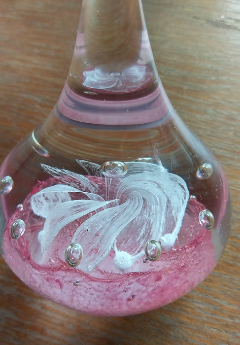 Vintage art glass paperweight in artistic teardrop design.